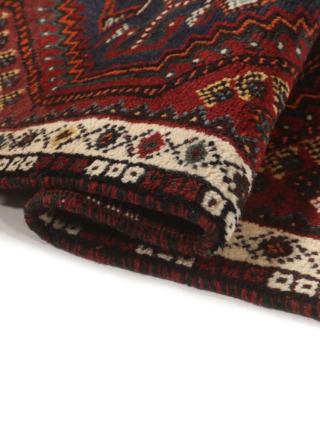 Hand-knotted Shiraz rug from the Middle East in deep red and blue tones