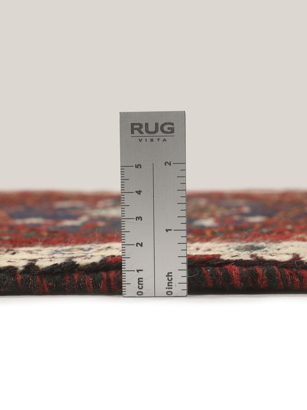 Hand-knotted Shiraz rug from the Middle East in deep red and blue tones