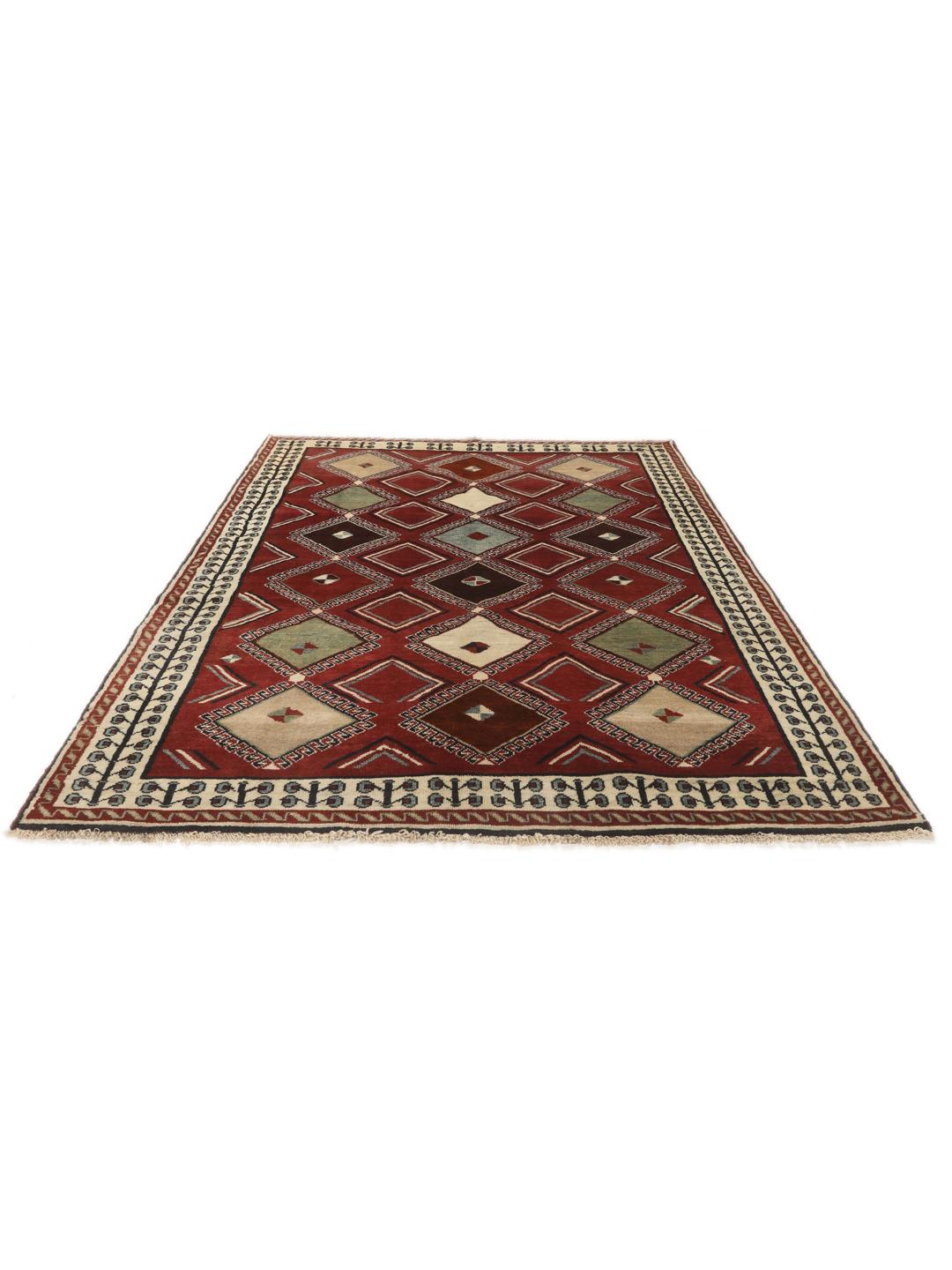 Hand-knotted Ghashghai rug from the Middle East featuring a vibrant red field with geometric diamond motifs.