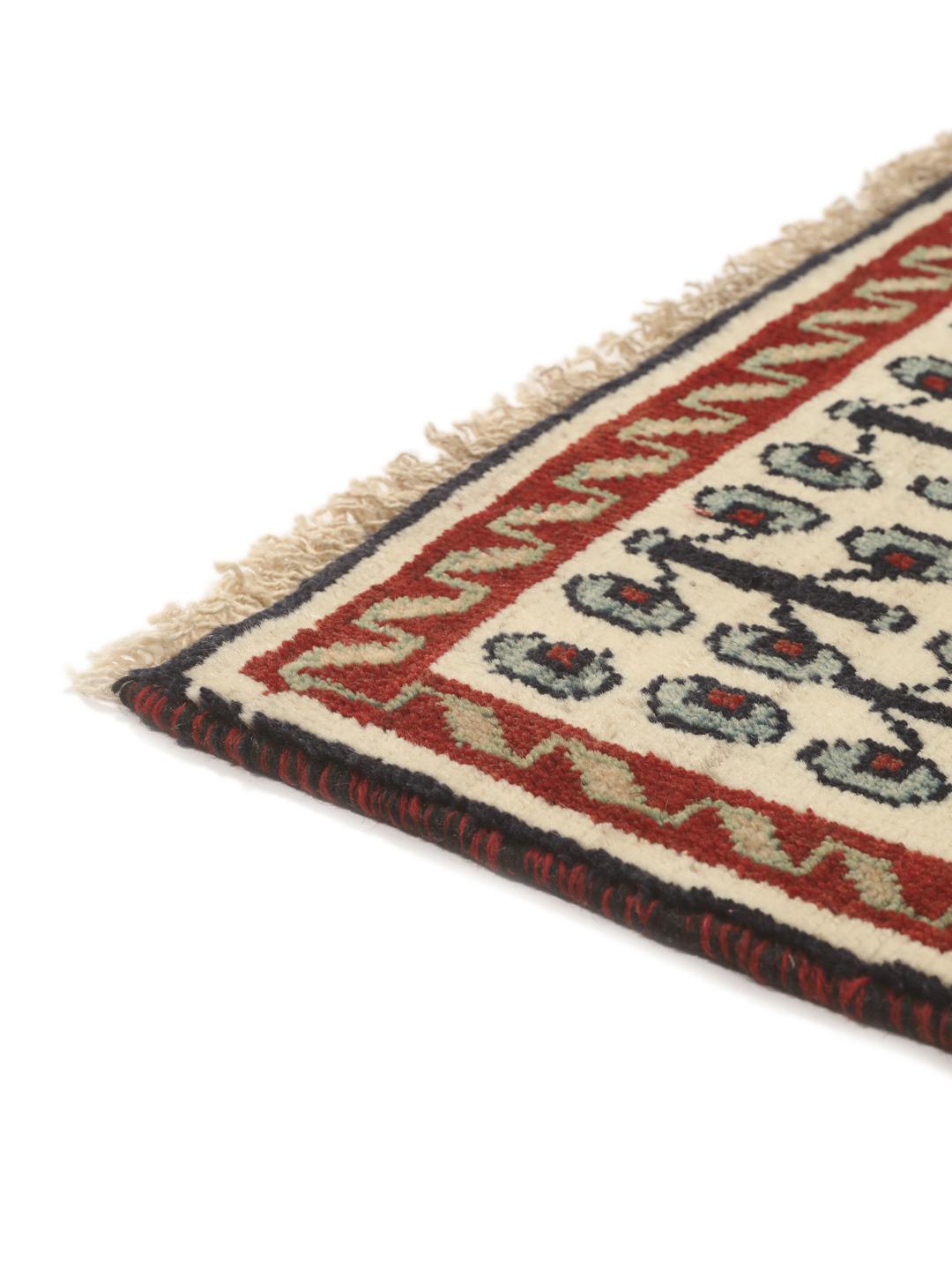 Hand-knotted Ghashghai rug from the Middle East featuring a vibrant red field with geometric diamond motifs.