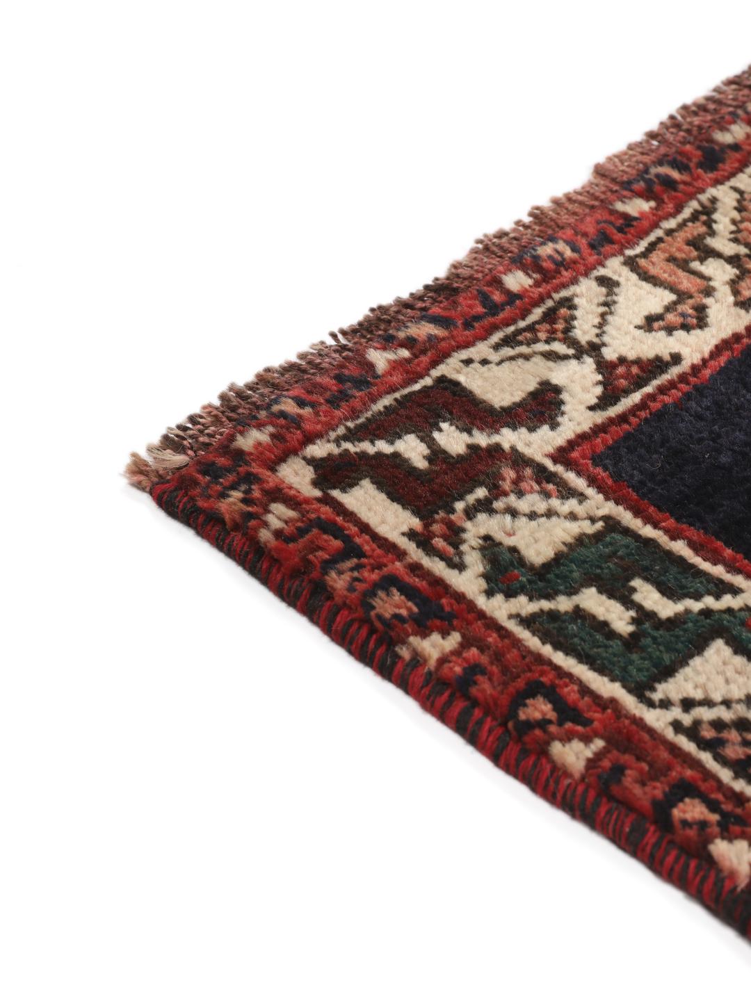 Hand-knotted wool rug from the Middle East in red and blue