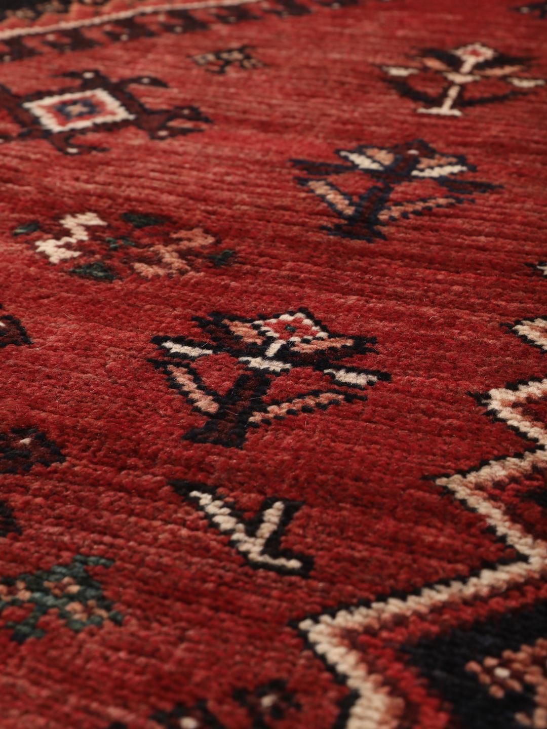 Hand-knotted wool rug from the Middle East in red and blue