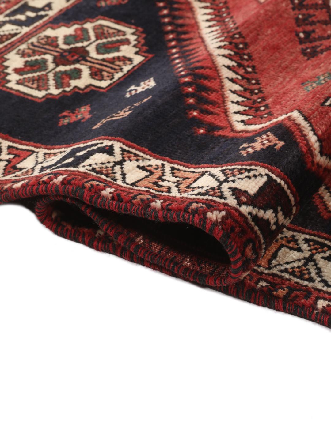 Hand-knotted wool rug from the Middle East in red and blue