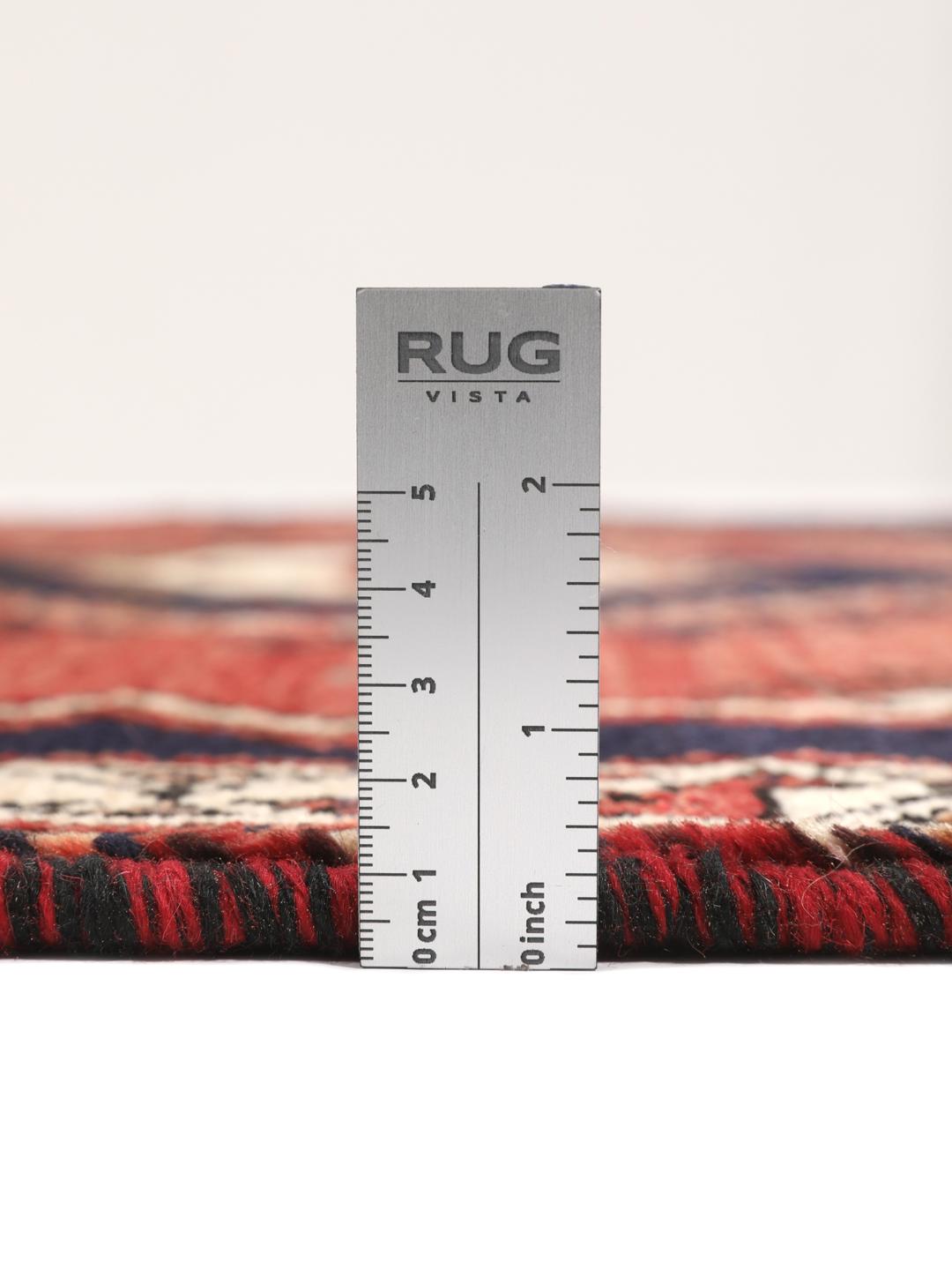Hand-knotted wool rug from the Middle East in red and blue