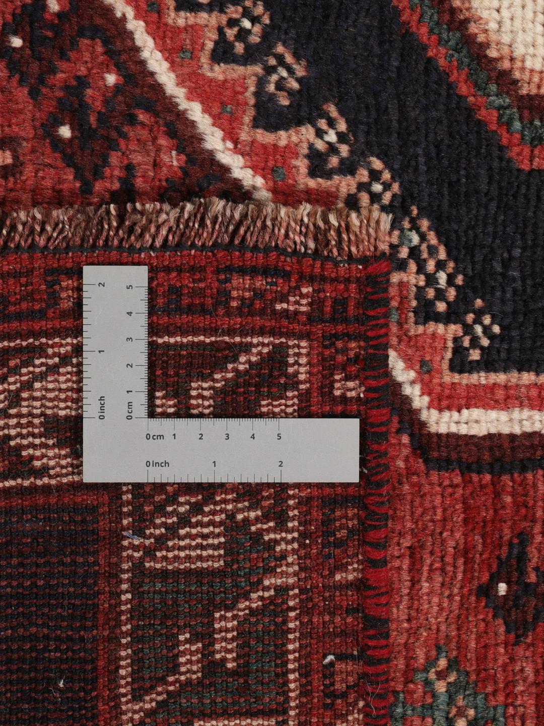 Hand-knotted wool rug from the Middle East in red and blue
