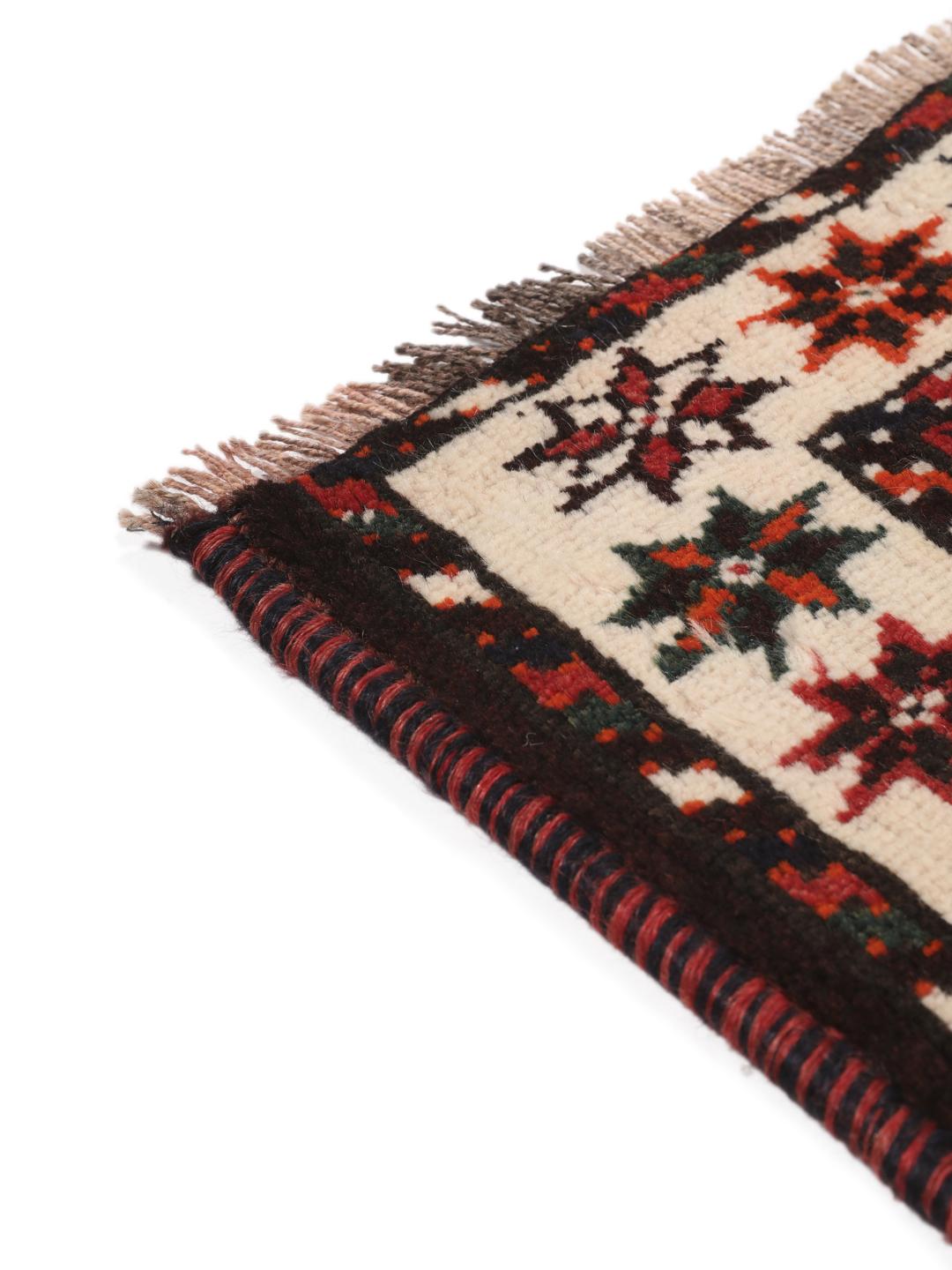 Hand-knotted Middle Eastern rug in red and black wool