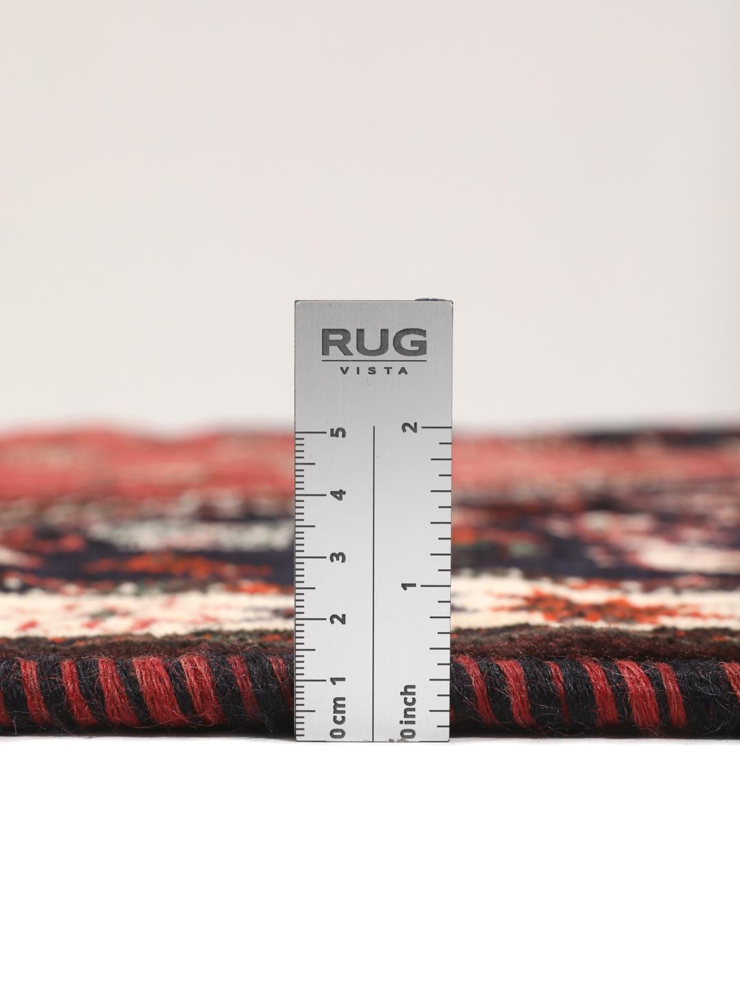 Hand-knotted Middle Eastern rug in red and black wool