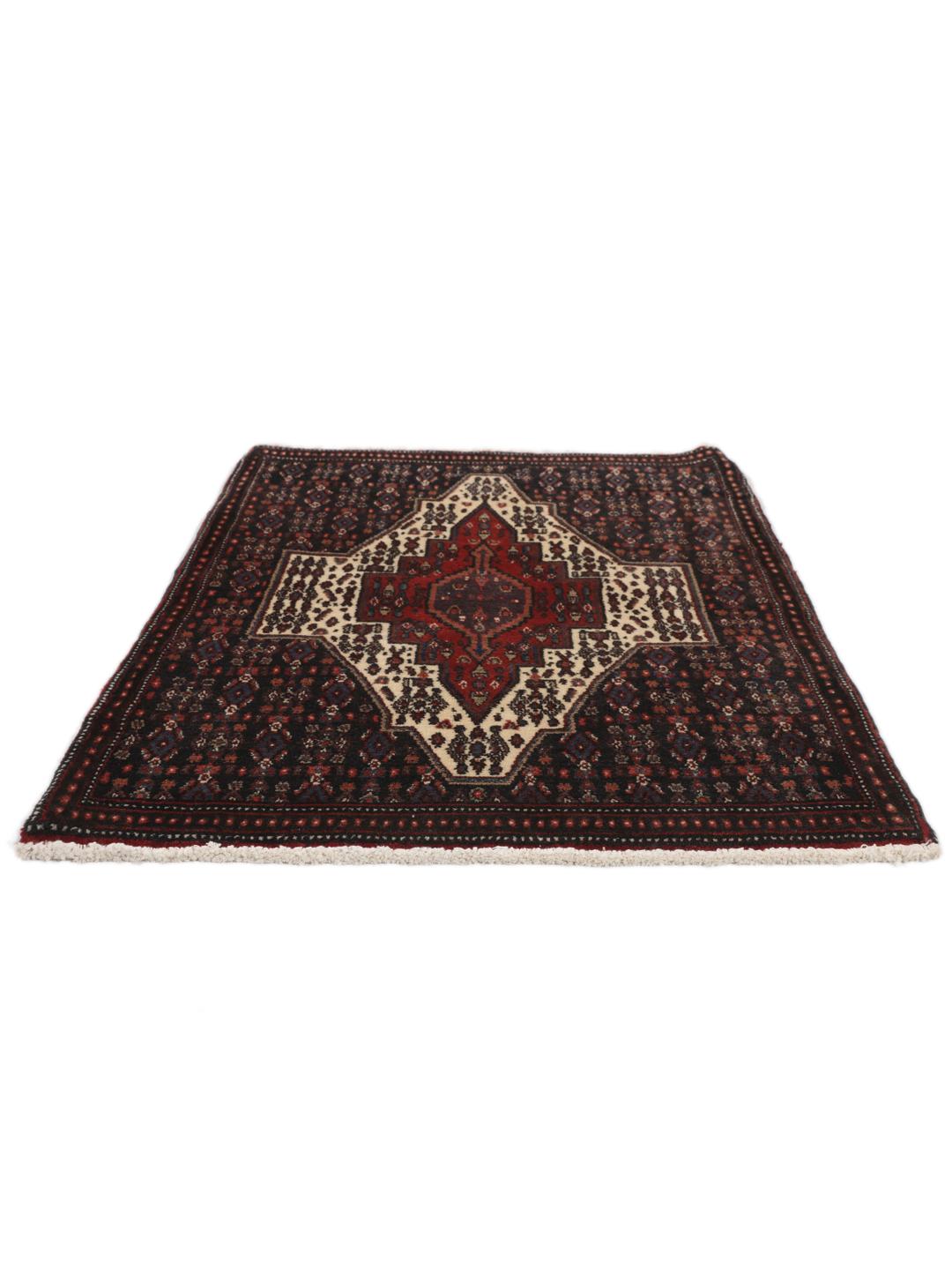 Hand-knotted Senneh rug from the Middle East in dark-blue and dark-red tones.