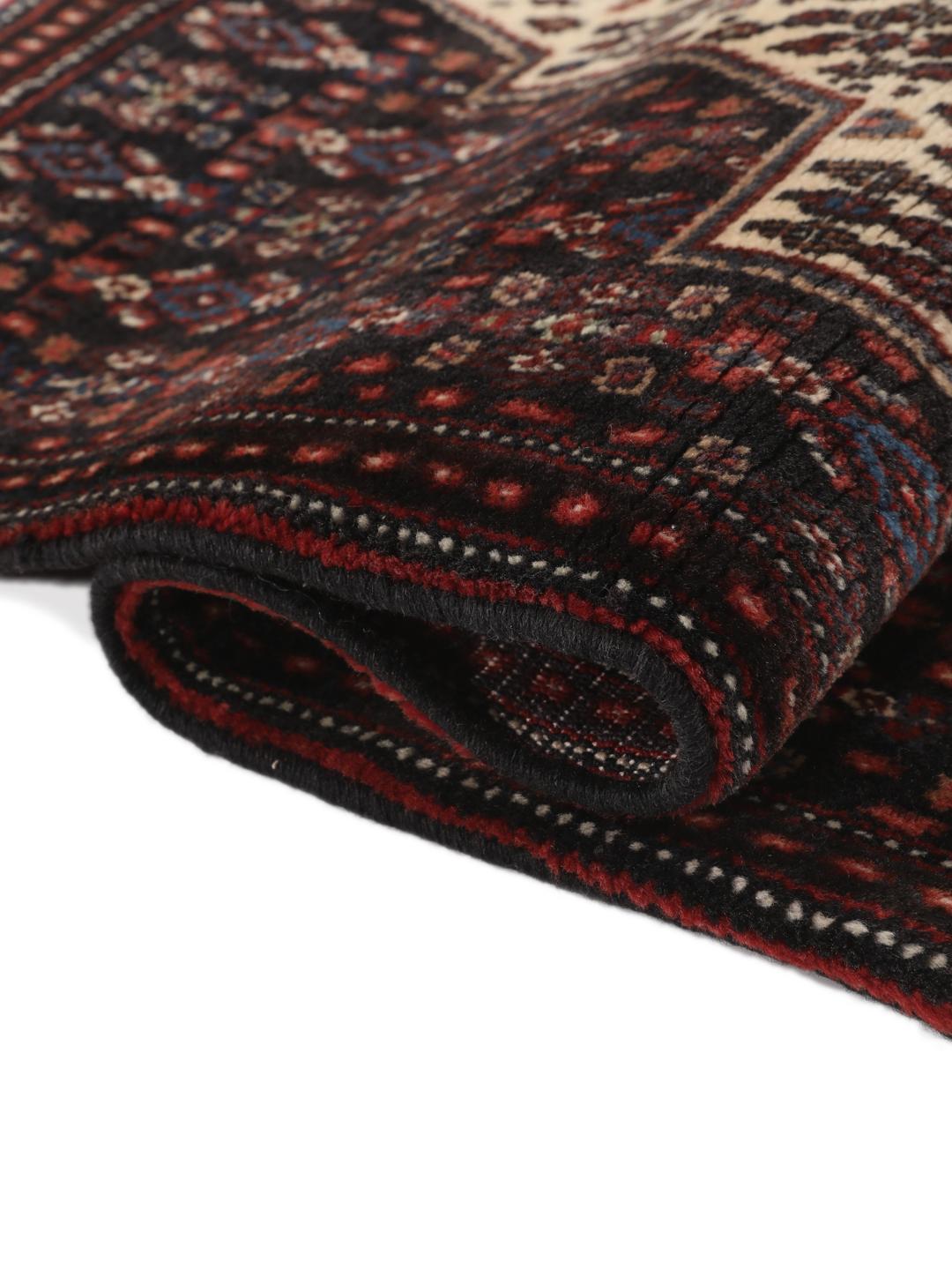 Hand-knotted Senneh rug from the Middle East in dark-blue and dark-red tones.