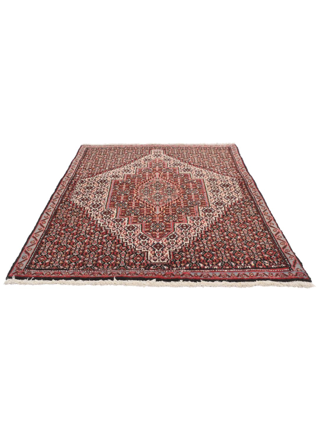 Hand-knotted Senneh rug from the Middle East in dark-red and black tones.