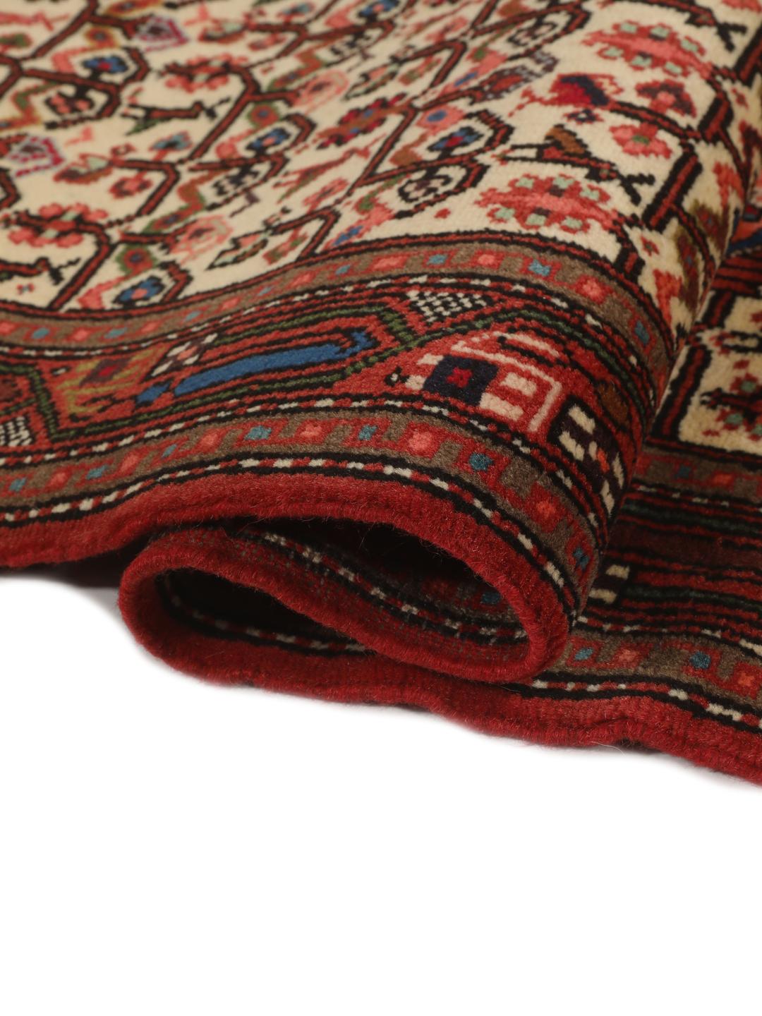 Handgeknoopte loper uit het Midden-Oosten met een rood en beige geometrisch patroon