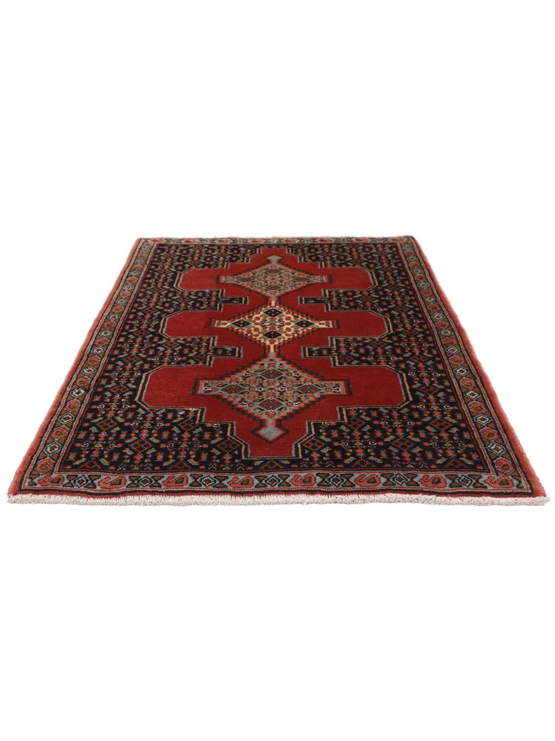 Hand-knotted Senneh rug from the Middle East in red and black