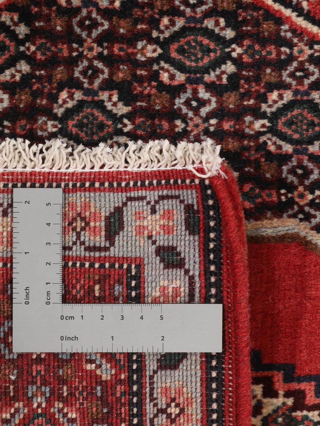Handgeknüpfter Senneh-Teppich aus dem Nahen Osten in tiefen Rot- und Blautönen
