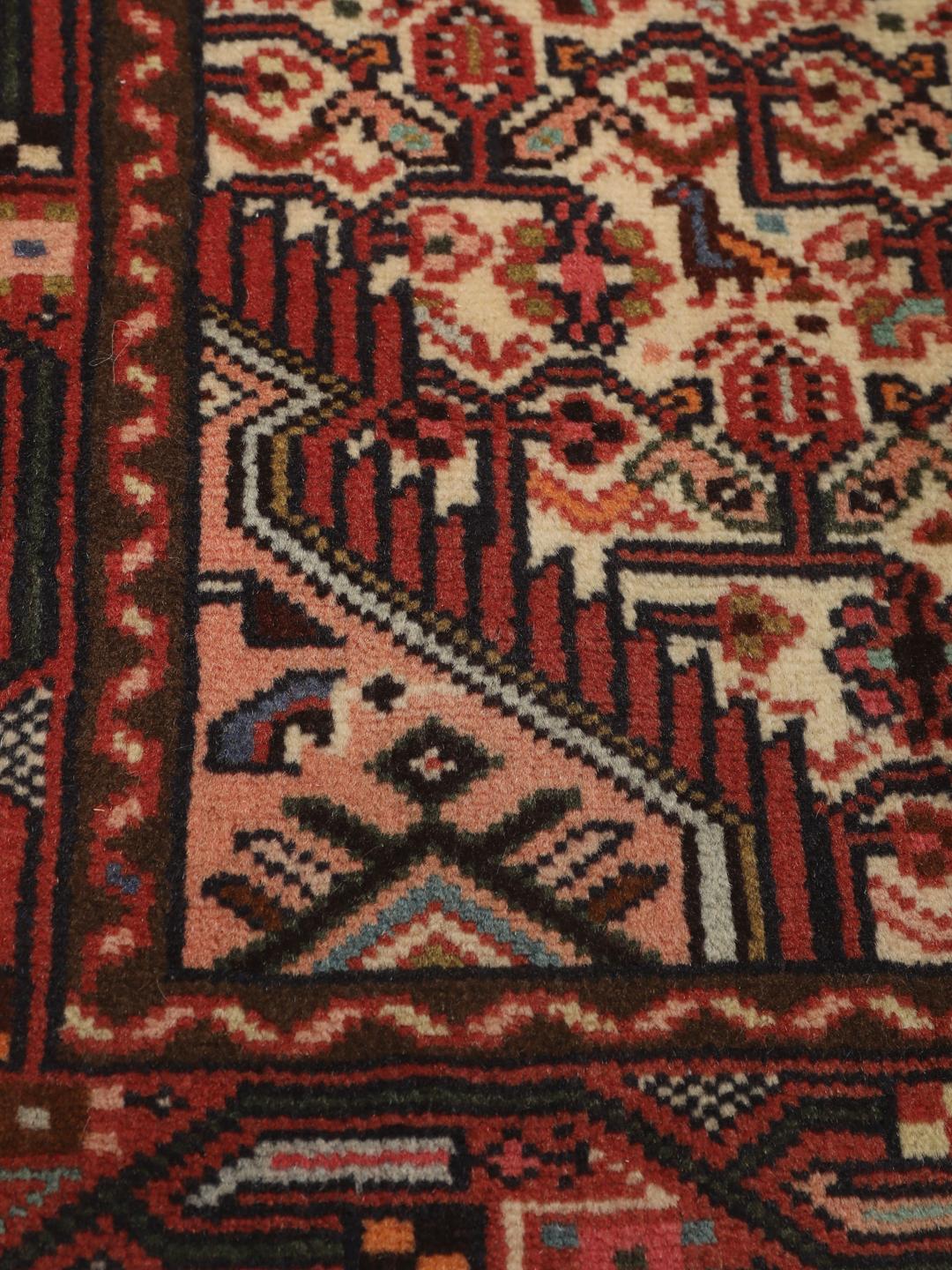 Handgeknoopte loper uit het Midden-Oosten in tinten rood en beige