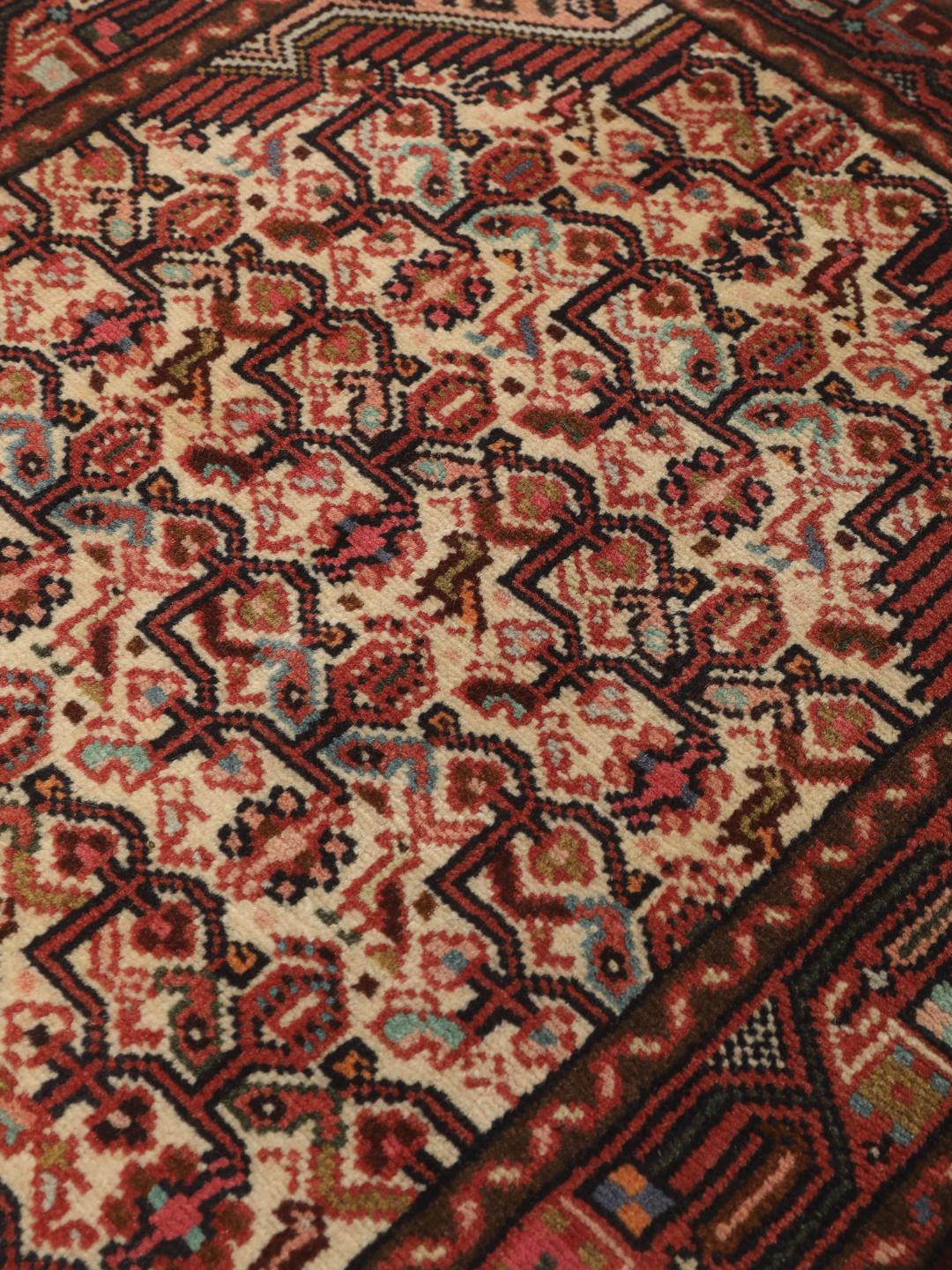 Handgeknoopte loper uit het Midden-Oosten in tinten rood en beige
