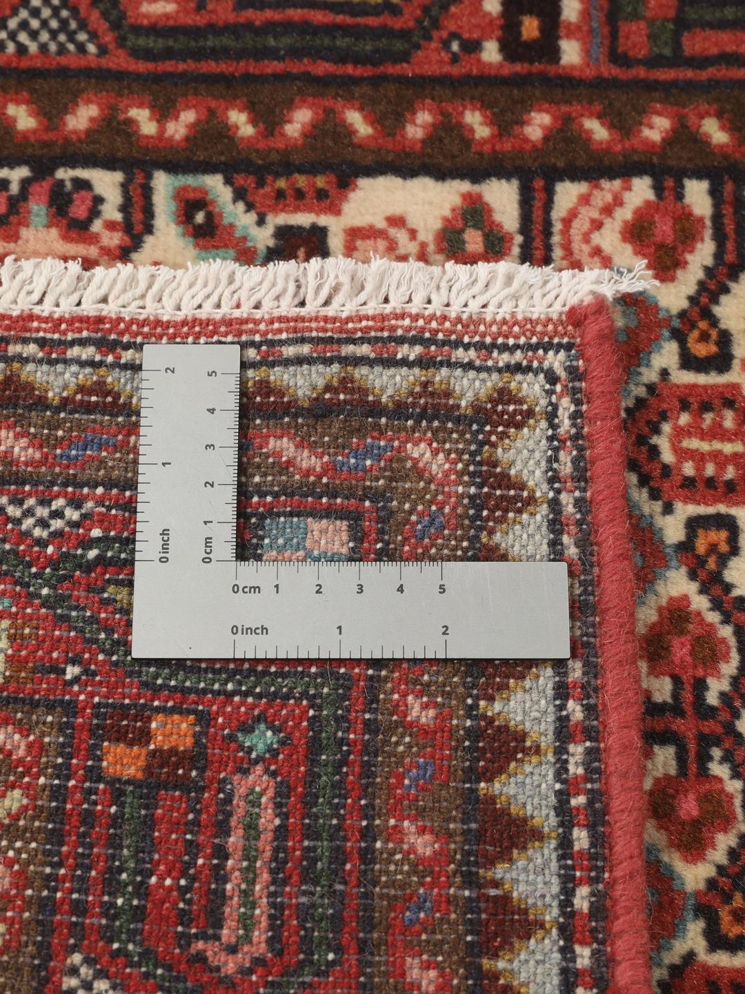 Handgeknoopte loper uit het Midden-Oosten in tinten rood en beige
