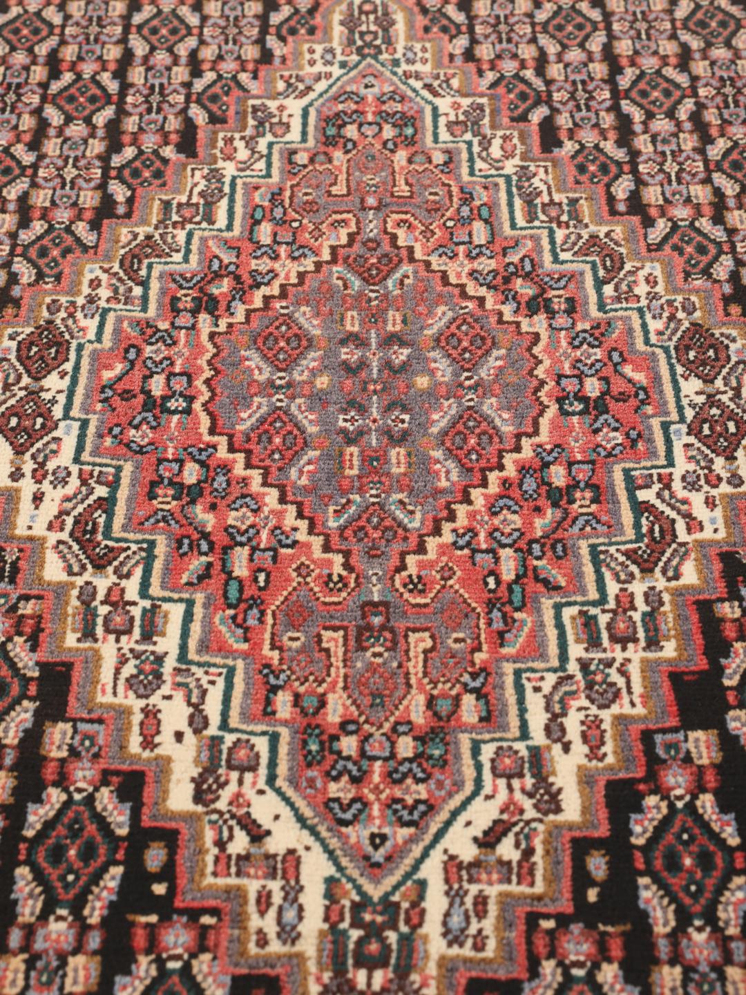 Hand-knotted Senneh rug from the Middle East in multicolor