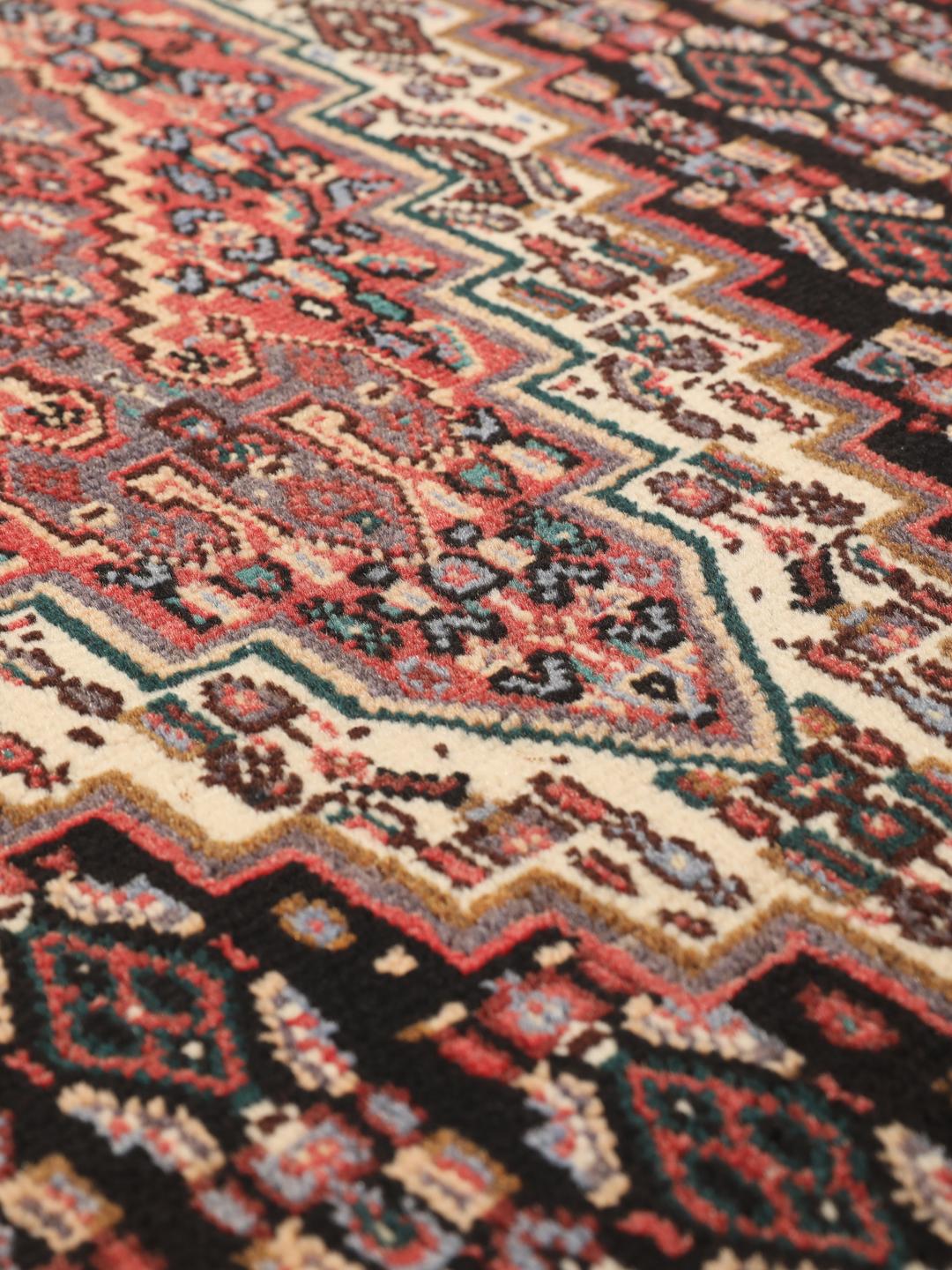 Hand-knotted Senneh rug from the Middle East in multicolor