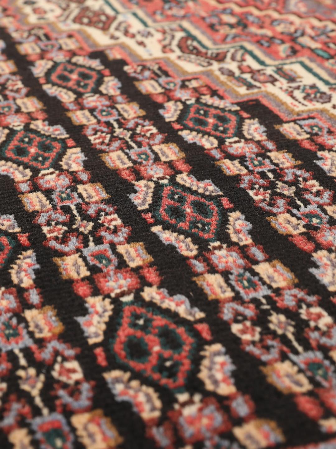 Hand-knotted Senneh rug from the Middle East in multicolor