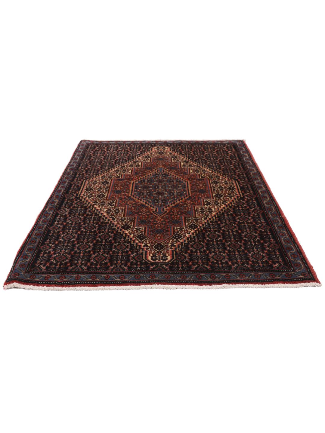 A hand-knotted Senneh rug from the Middle East in dark-blue and dark-red tones.