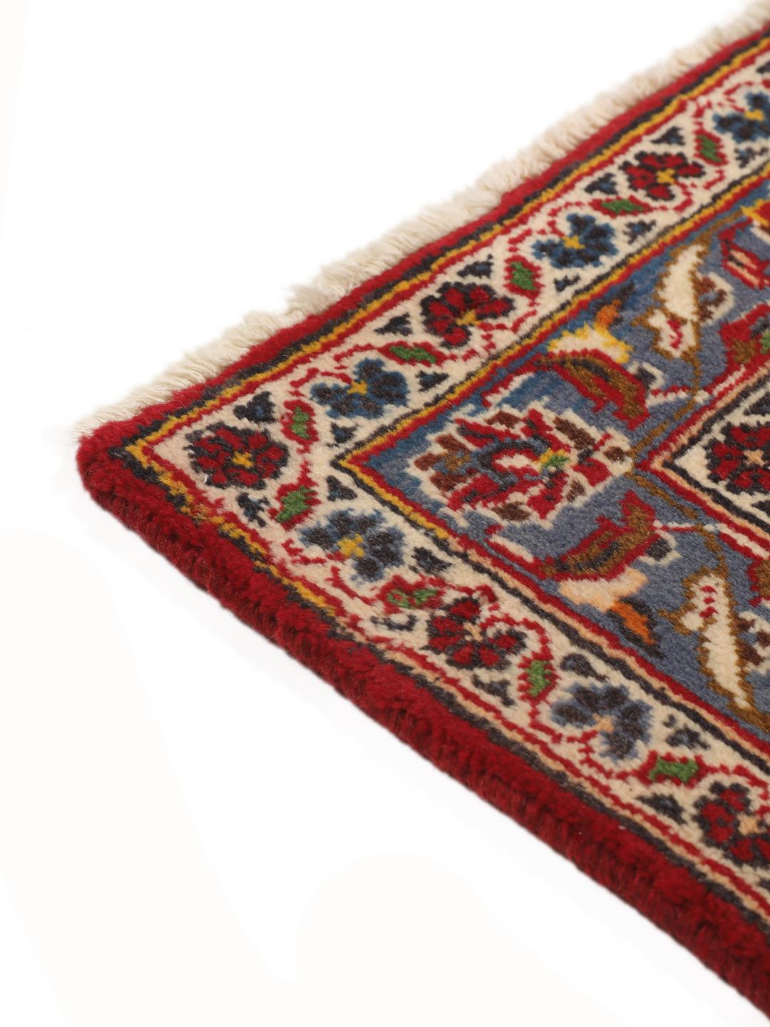 Hand-knotted Keshan rug from the Middle East in dark-red and blue