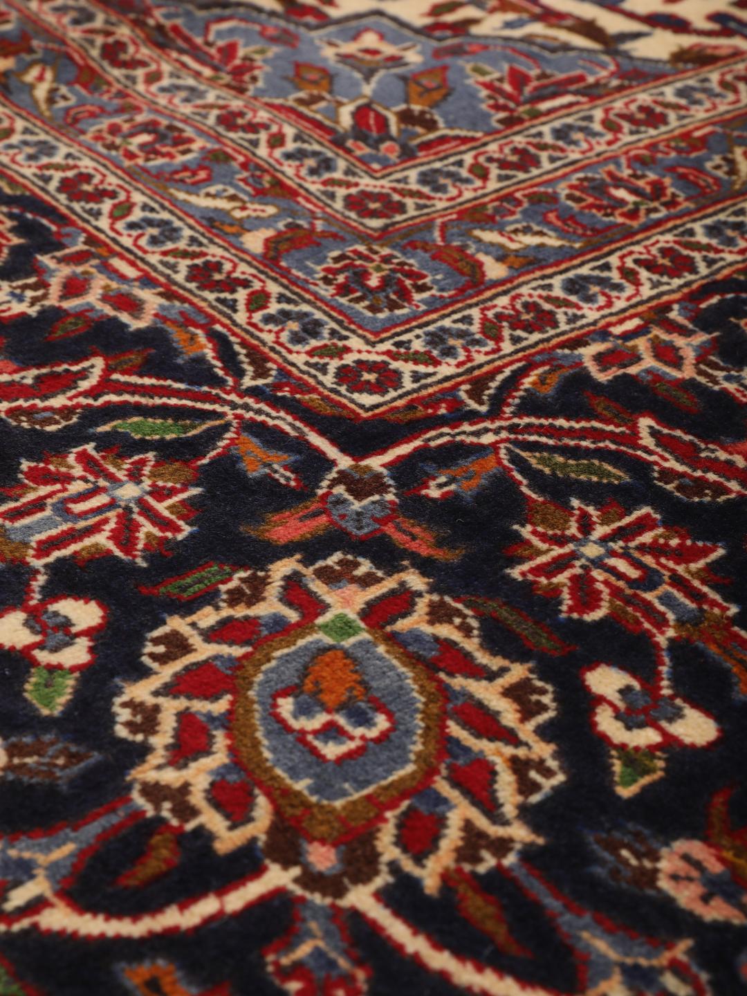 Hand-knotted Keshan rug from the Middle East in dark-red and blue