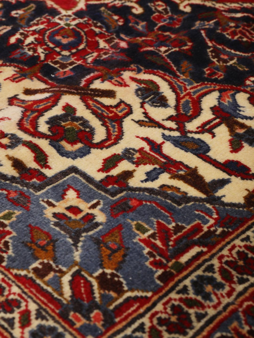 Hand-knotted Keshan rug from the Middle East in dark-red and blue