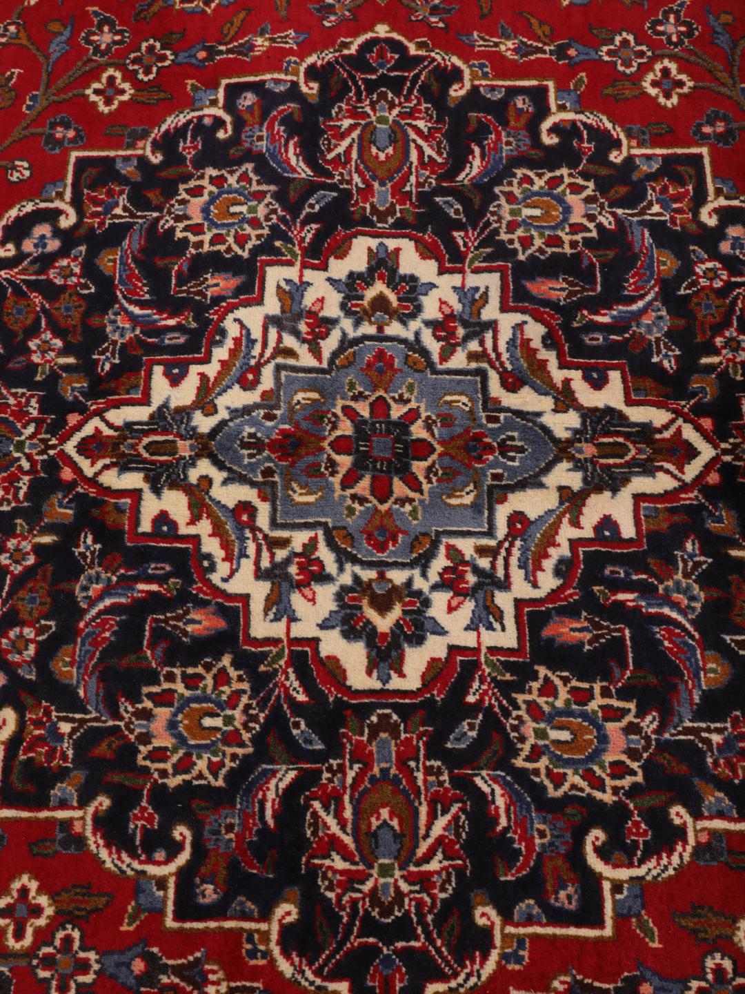 Hand-knotted Keshan rug from the Middle East in dark-red and blue