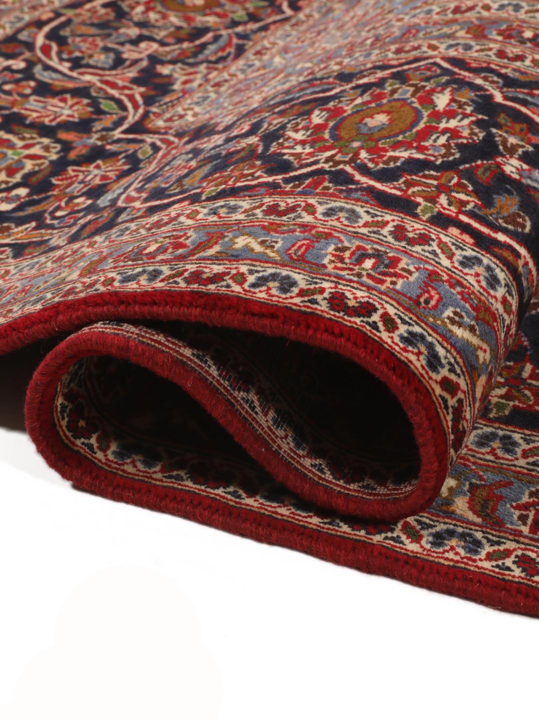 Hand-knotted Keshan rug from the Middle East in dark-red and blue
