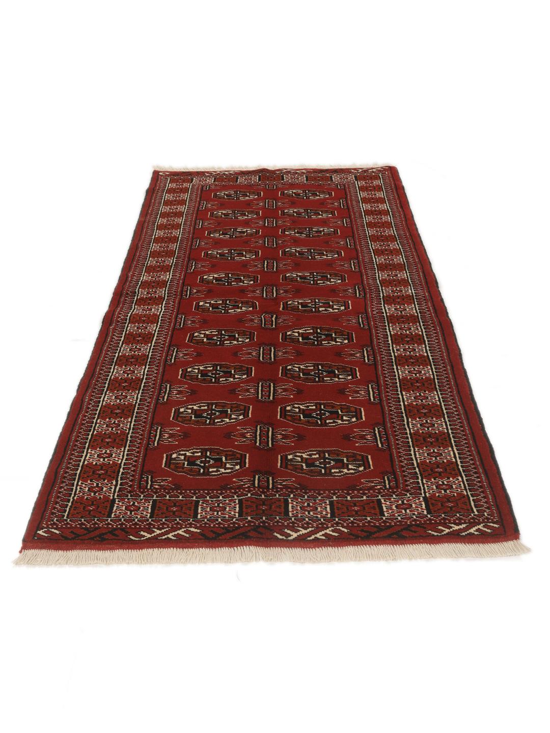 Hand-knotted Middle Eastern Turkaman runner in red with geometric motifs