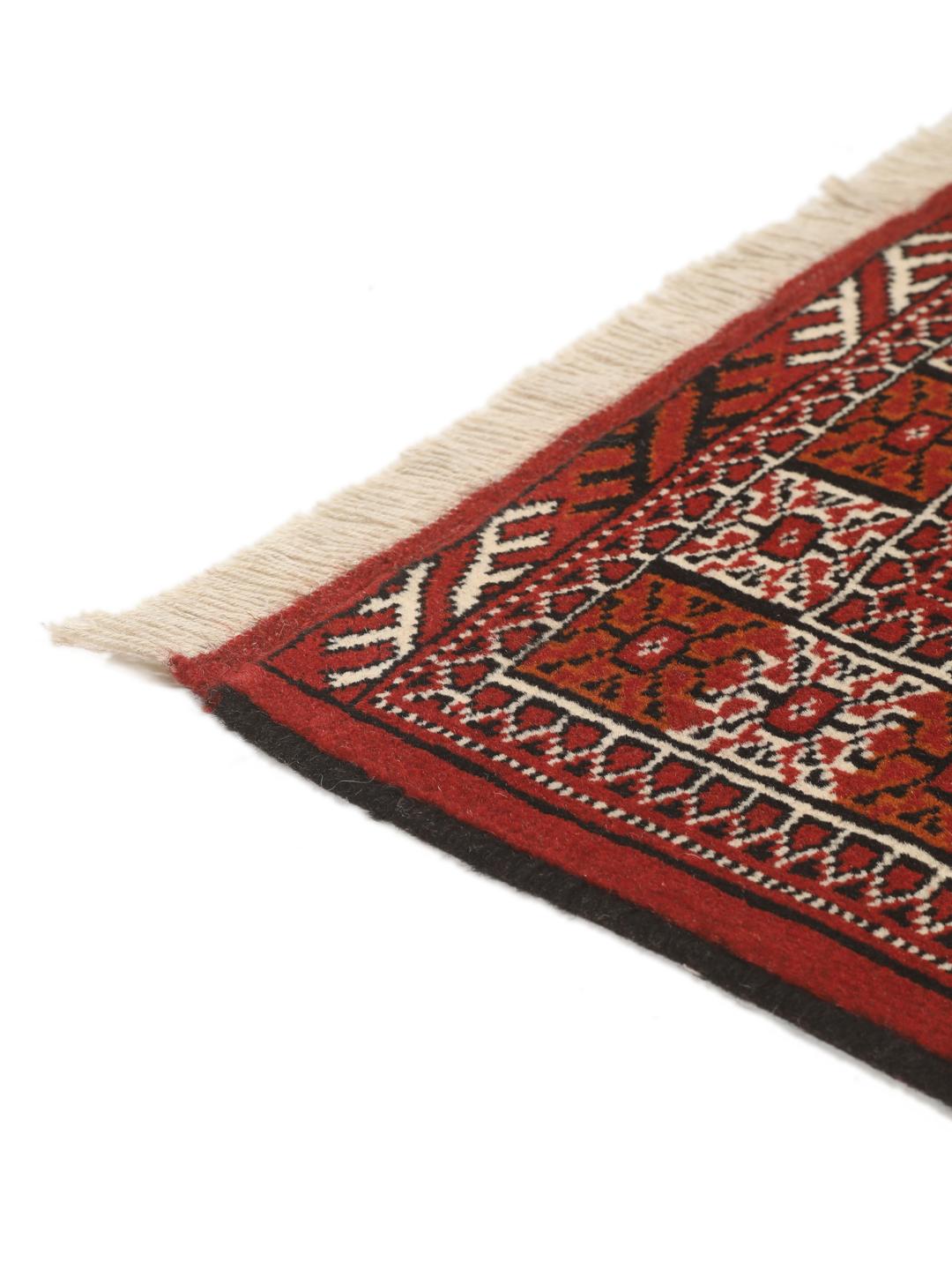 Hand-knotted Middle Eastern Turkaman runner in red with geometric motifs