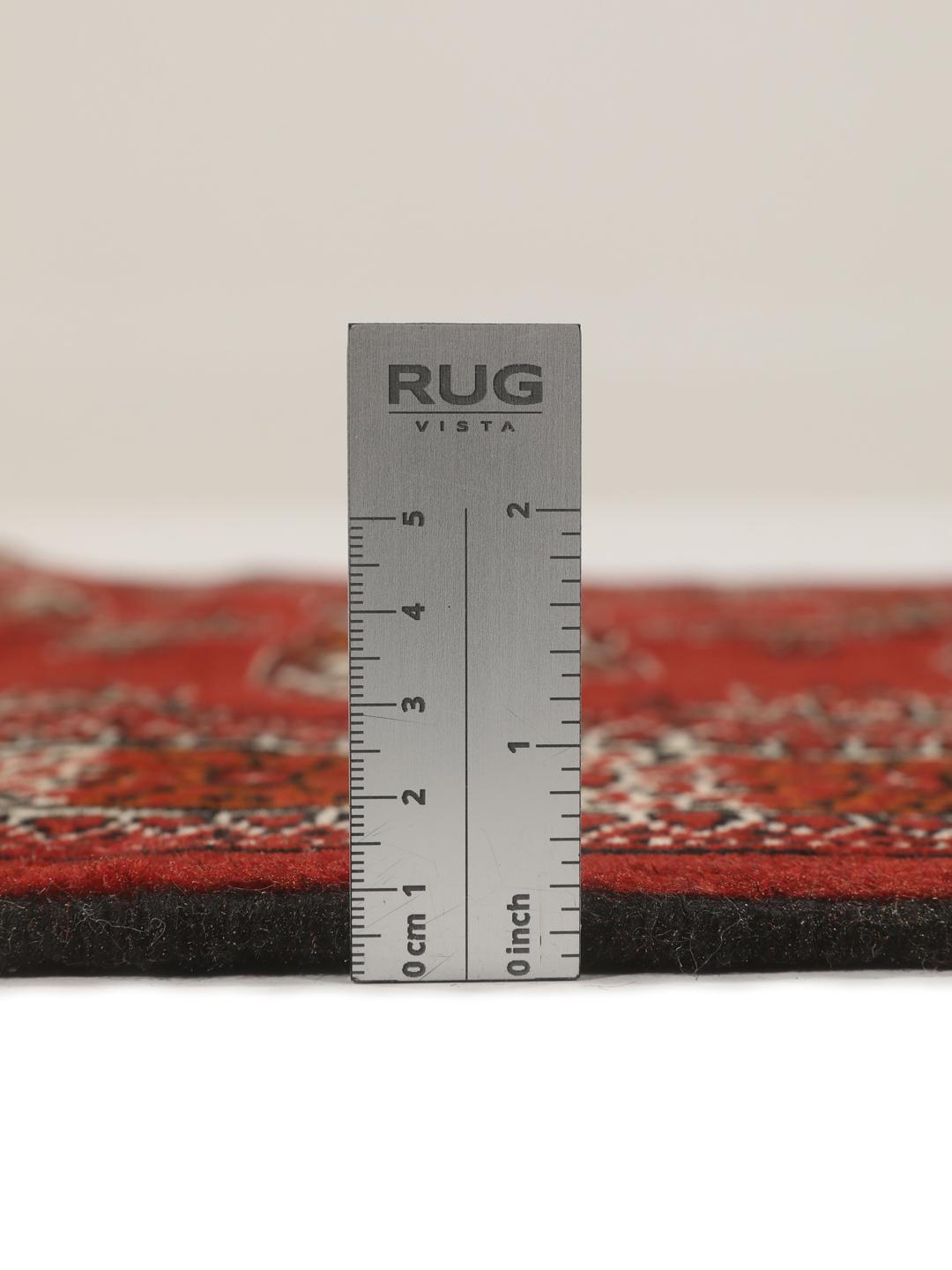 Hand-knotted Middle Eastern Turkaman runner in red with geometric motifs