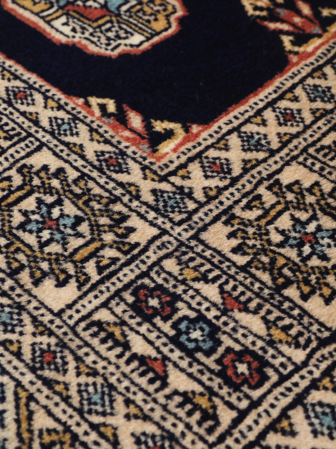 Hand-knotted Pakistan Bokhara runner in dark-blue with geometric motifs