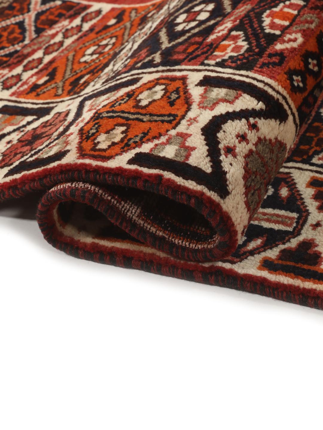 Hand-knotted Shiraz rug from the Middle East featuring a red and black geometric design