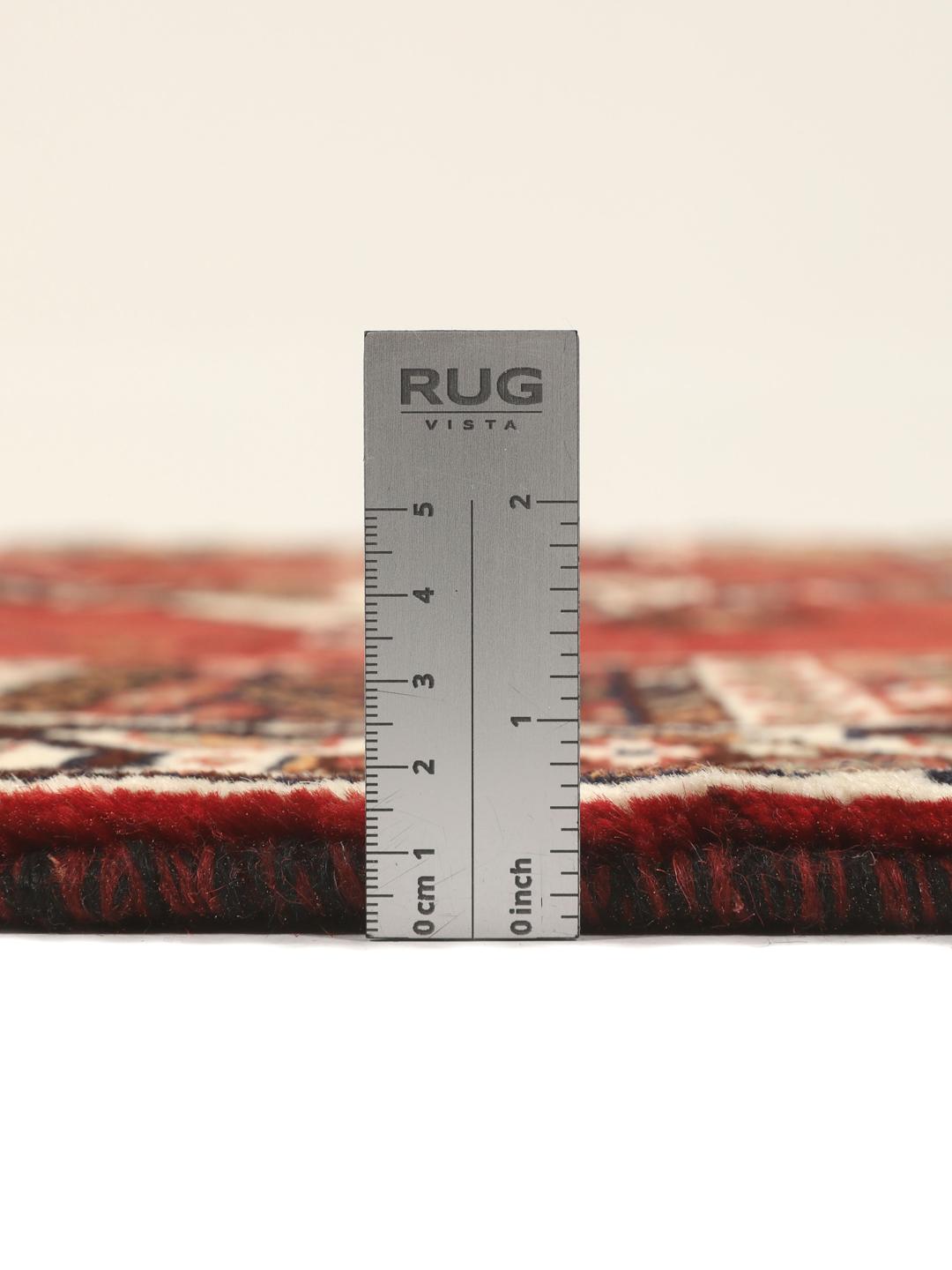Hand-knotted Shiraz rug from the Middle East featuring a red and black geometric design