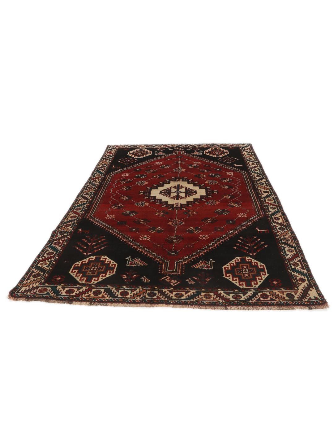 Hand-knotted Shiraz rug from the Middle East featuring a vibrant multicolor tribal design.