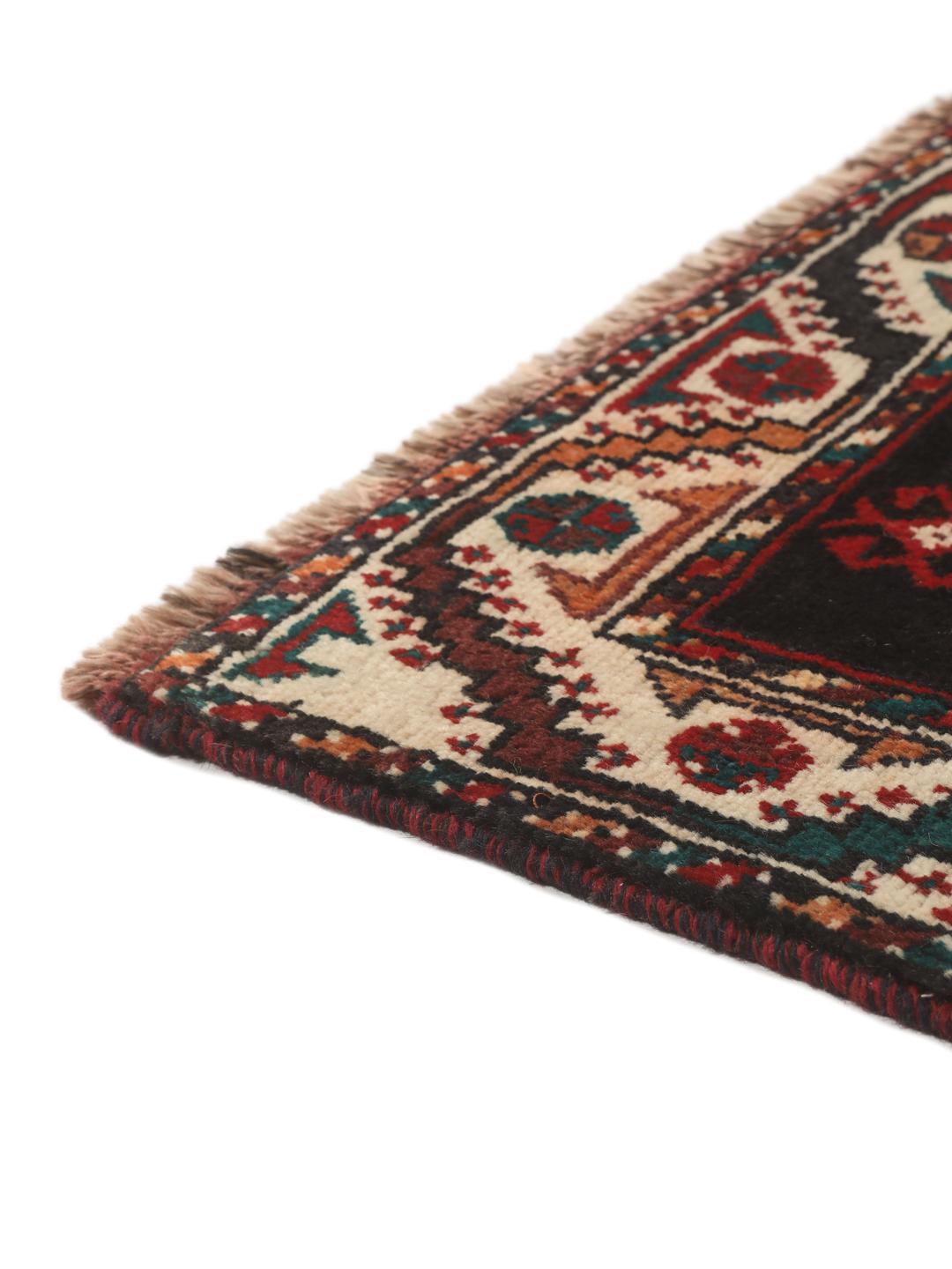 Hand-knotted Shiraz rug from the Middle East featuring a vibrant multicolor tribal design.