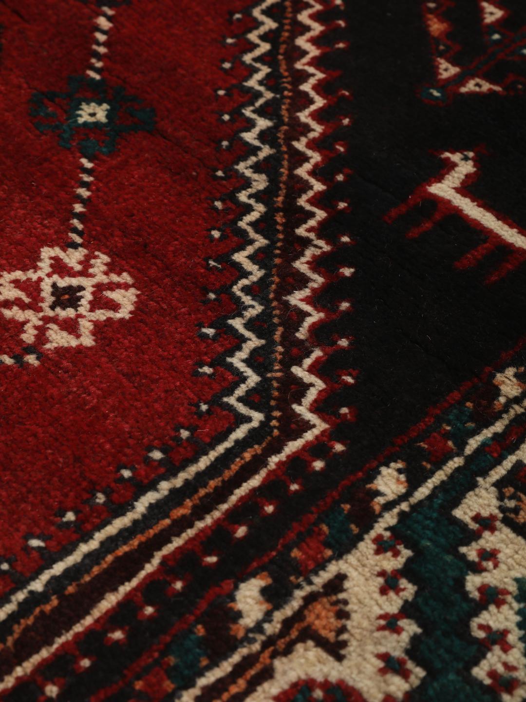 Hand-knotted Shiraz rug from the Middle East featuring a vibrant multicolor tribal design.