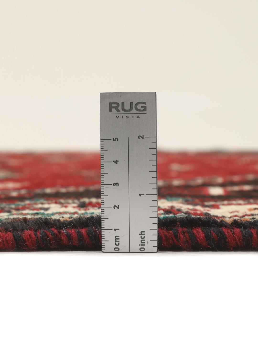 Hand-knotted Shiraz rug from the Middle East featuring a vibrant multicolor tribal design.
