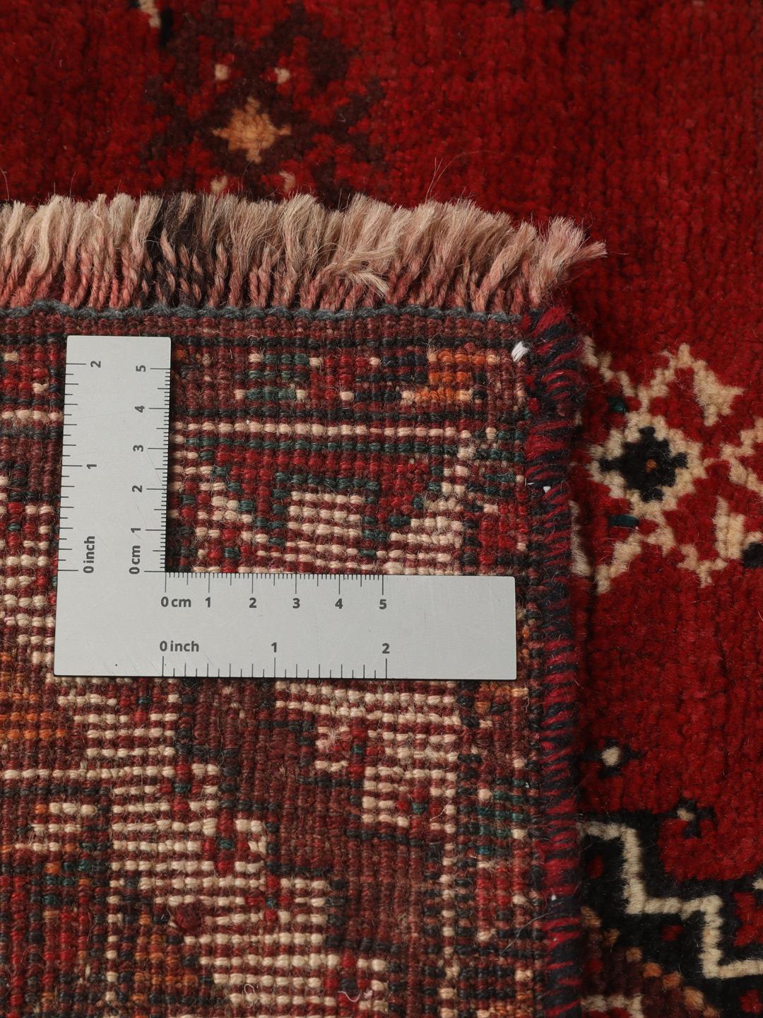 Hand-knotted Shiraz rug from the Middle East featuring a vibrant multicolor tribal design.