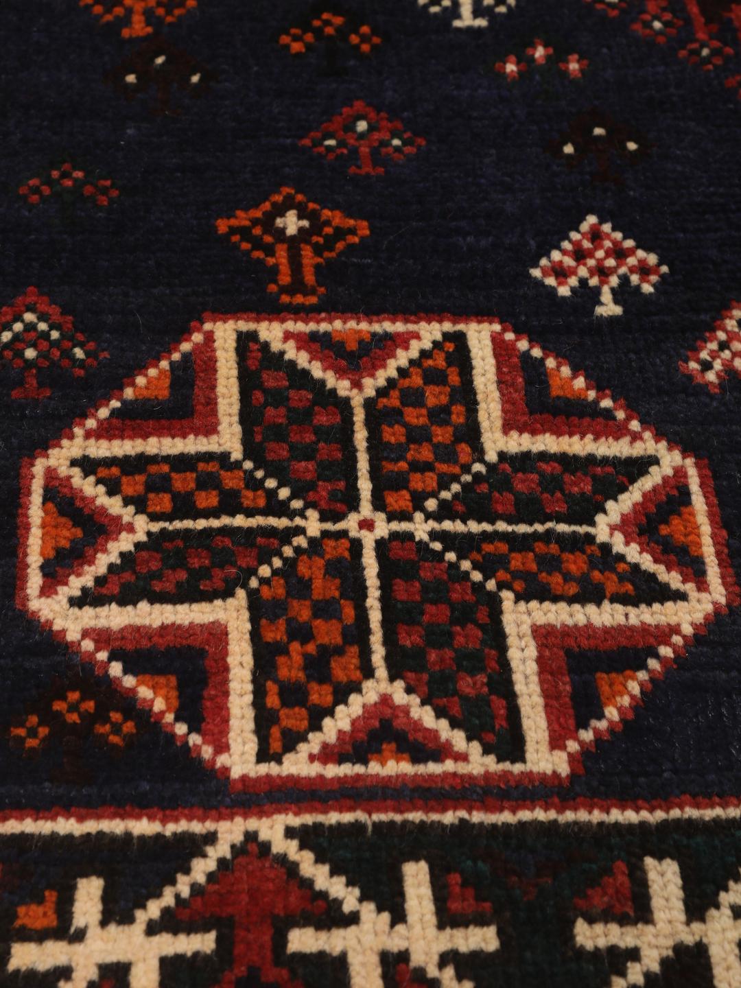 Hand-knotted Shiraz rug from the Middle East in red and navy blue