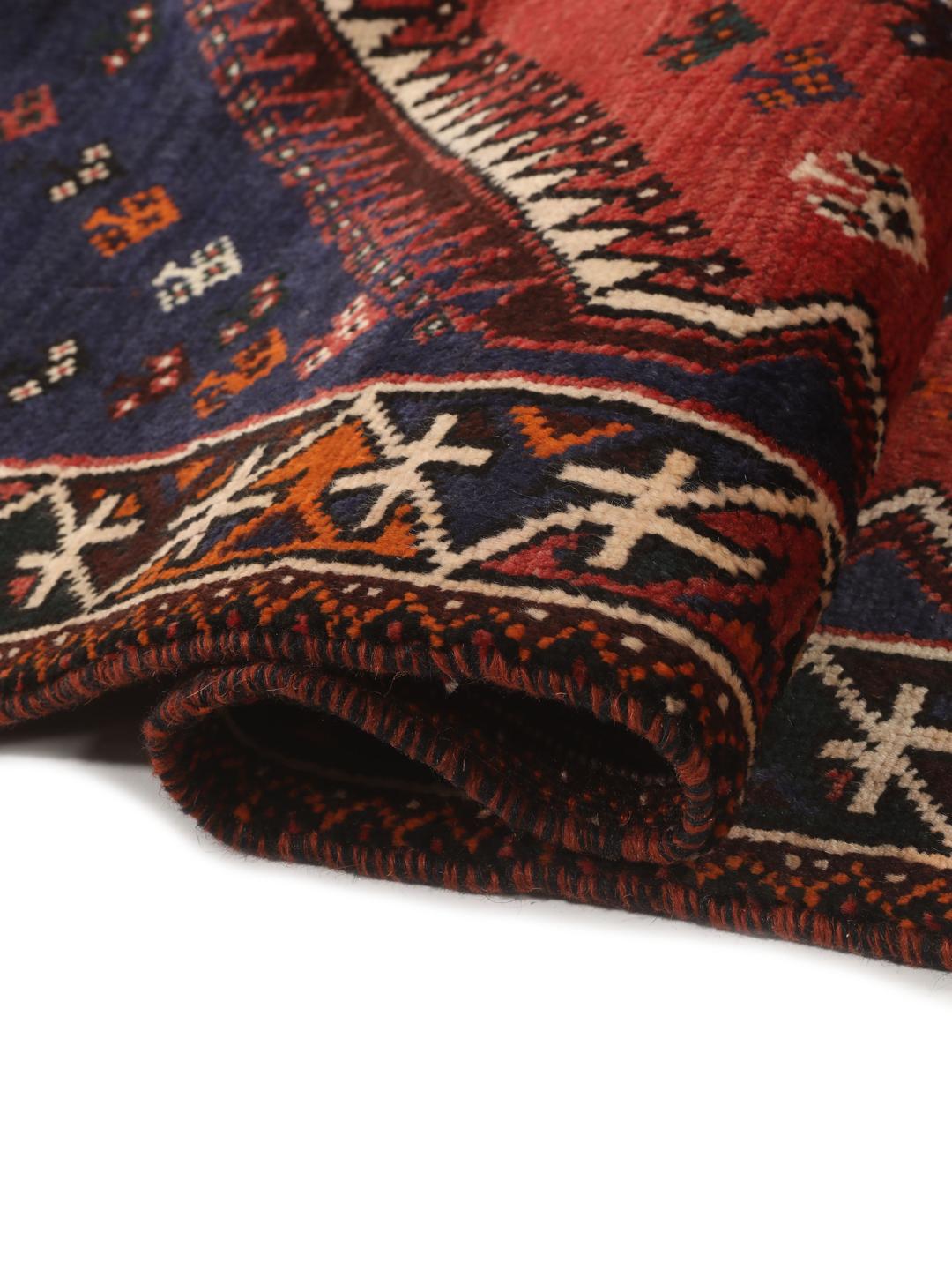 Hand-knotted Shiraz rug from the Middle East in red and navy blue