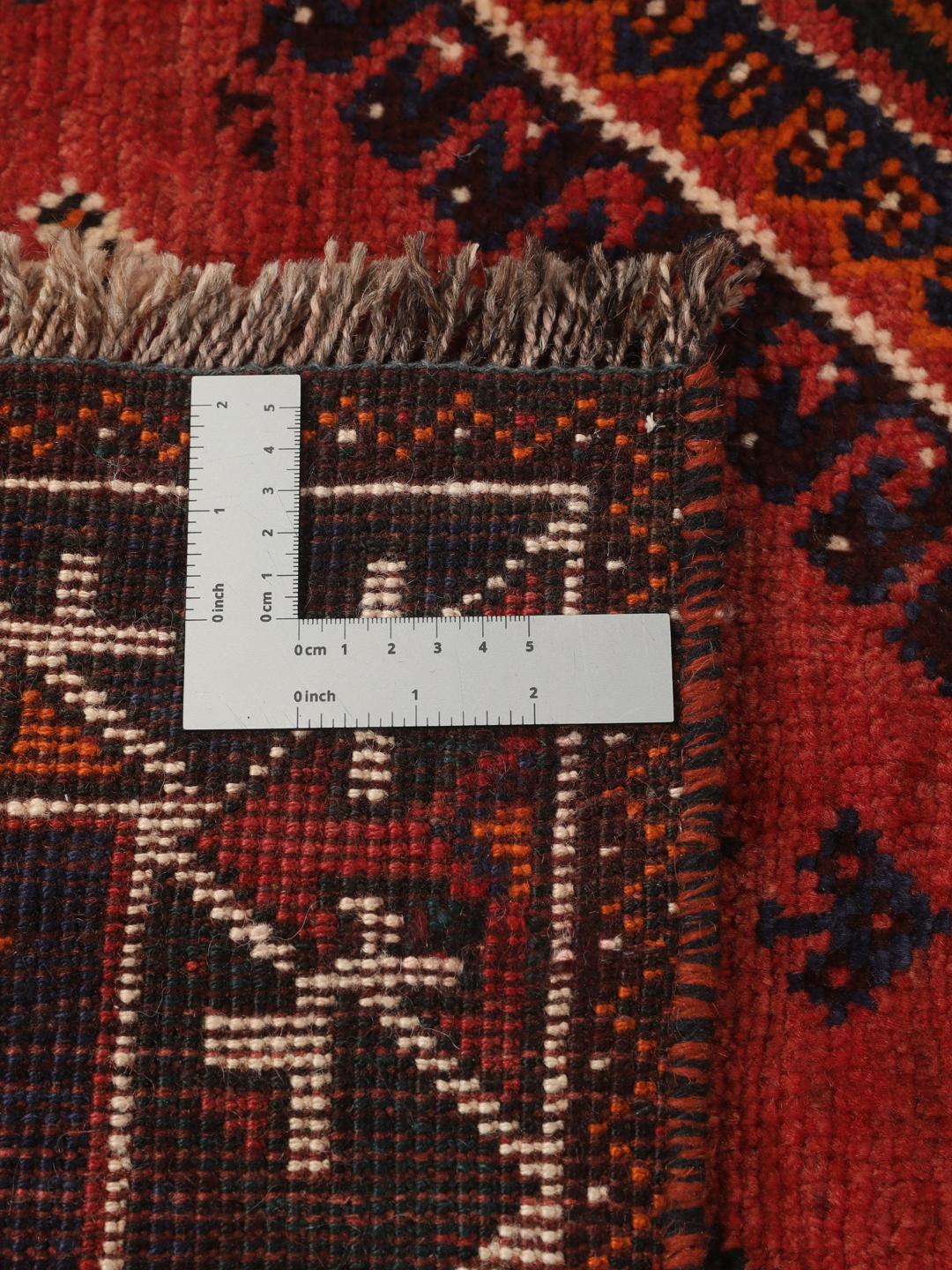Hand-knotted Shiraz rug from the Middle East in red and navy blue