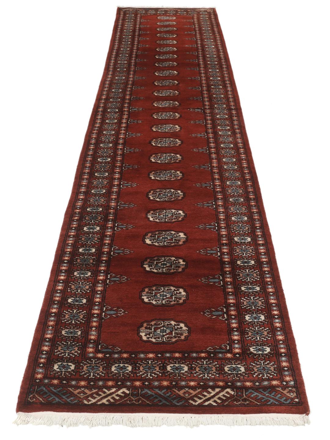 Hand-knotted Pakistan Bokhara runner in deep red