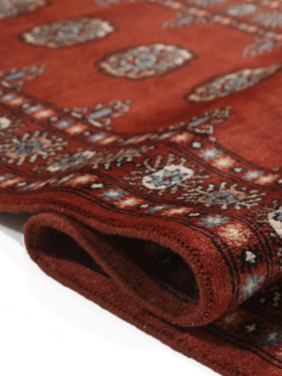 Hand-knotted Pakistan Bokhara runner in deep red