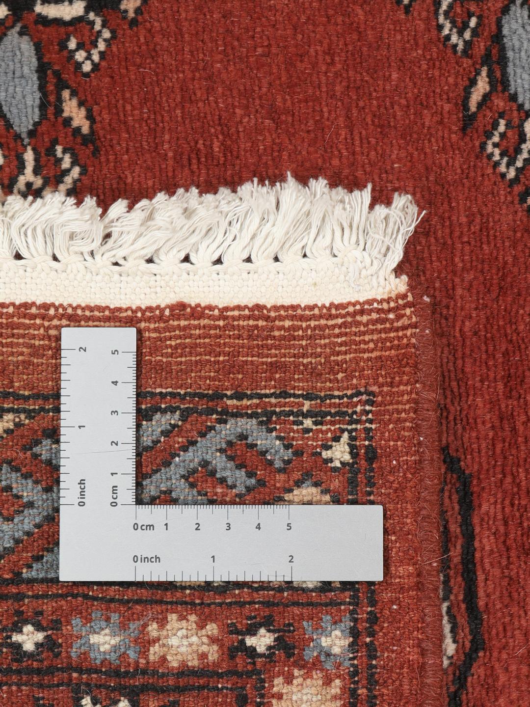 Hand-knotted Pakistan Bokhara runner in deep red