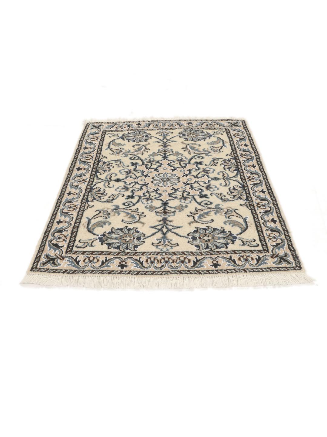 Hand-knotted Nain rug from the Middle East with a light beige field and blue floral motifs