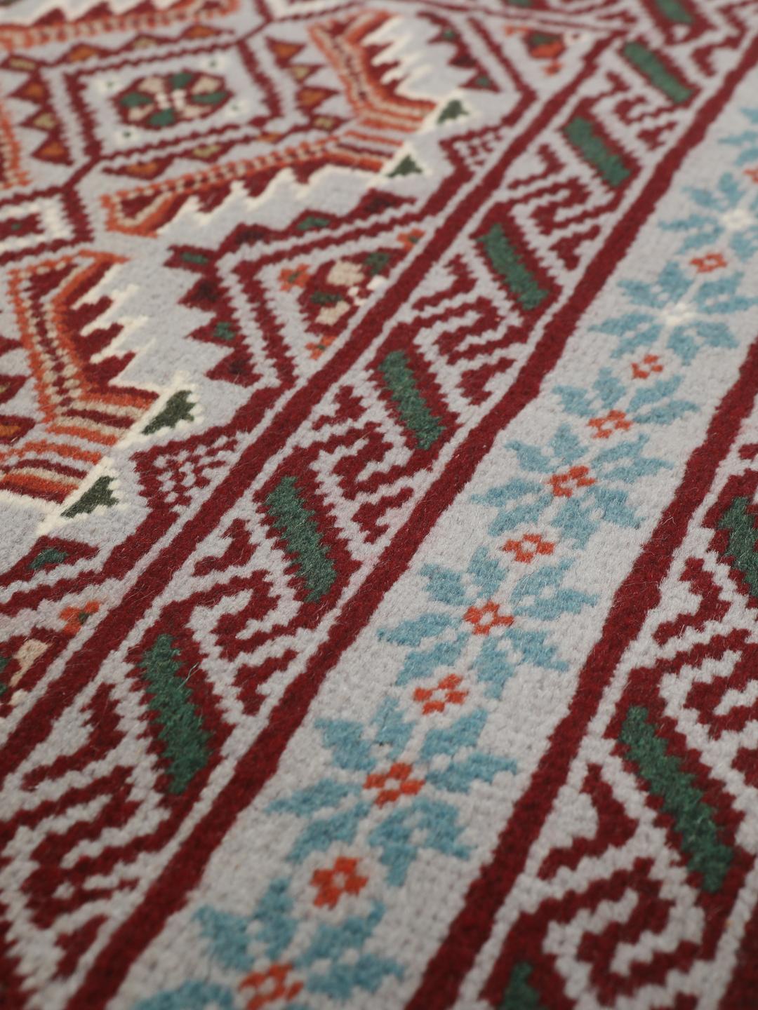Hand-knotted Middle Eastern Baluch rug in red and grey wool