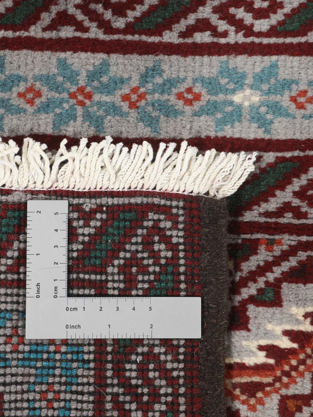 Hand-knotted Middle Eastern Baluch rug in red and grey wool