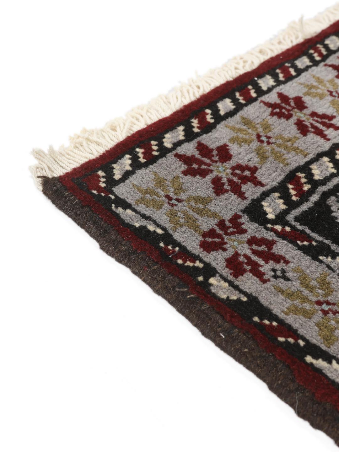 Hand-knotted Beluch rug with geometric patterns in multicolor from the Middle East